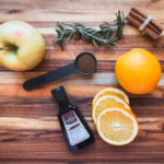 Board featuring simmer pot recipe ingredients