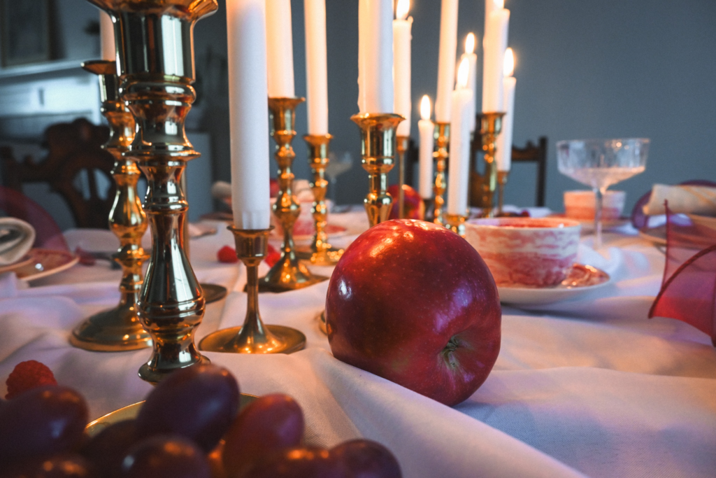 Apple on table with candles