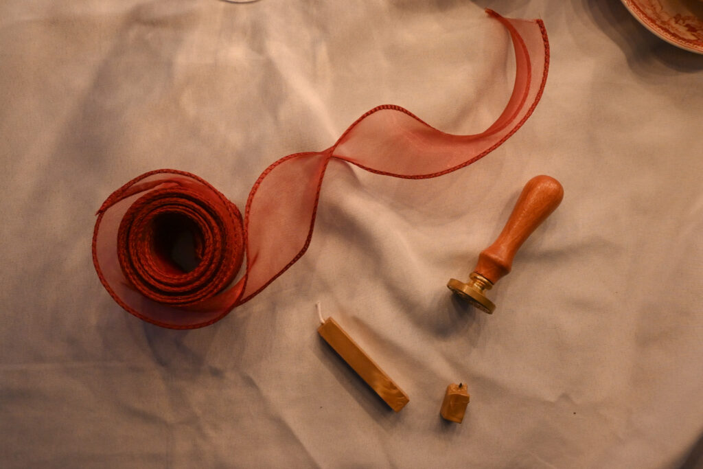 Silk red organza ribbon roll with wax seal stamp