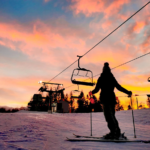Girl skiing at sunset