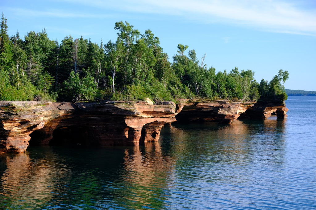 Meyers beach sea caves with caves and trees.