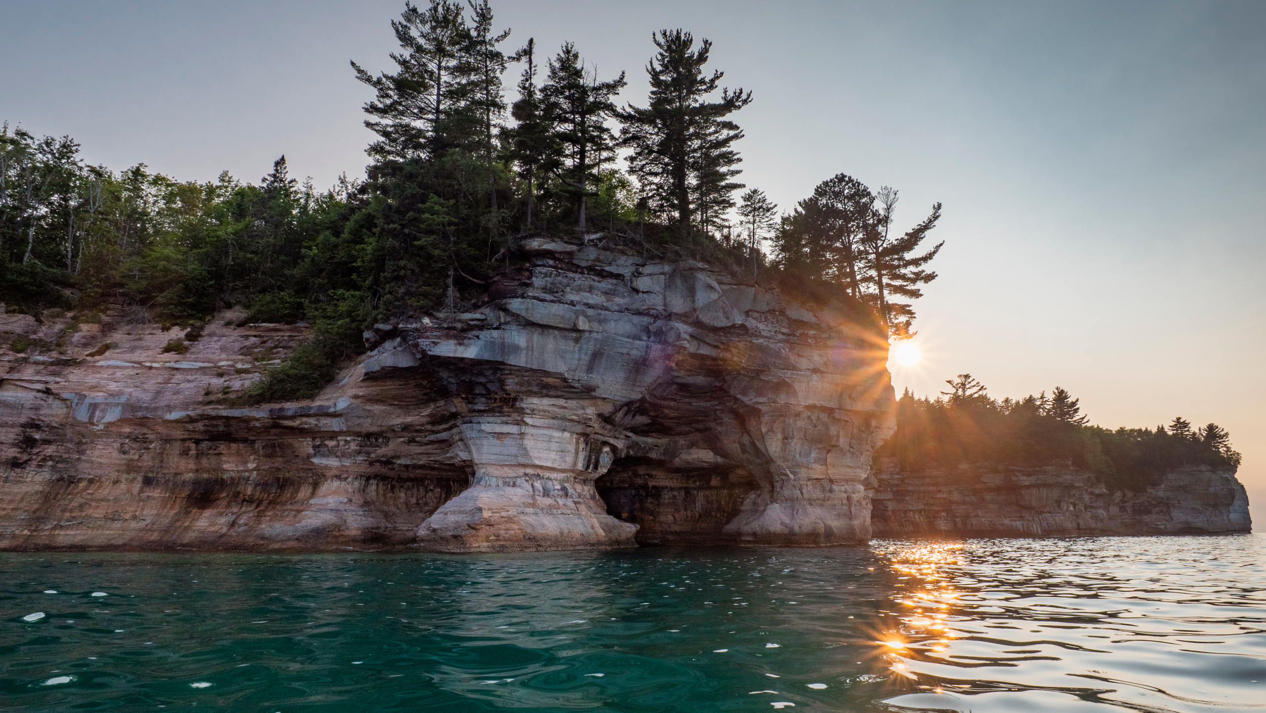 Pictured rocks national lakeshore with sun rising