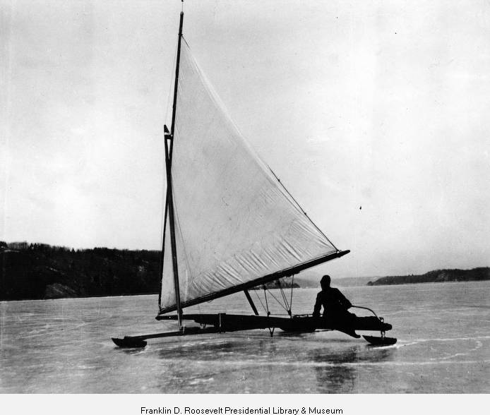 A black and white archival photograph from 1893 of the large ice yacht 'Icicle' with expansive white sails on the frozen Hudson River.