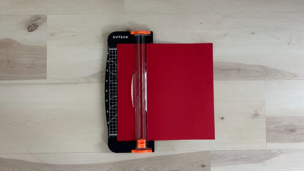Paper cutter with red card stock paper inserted