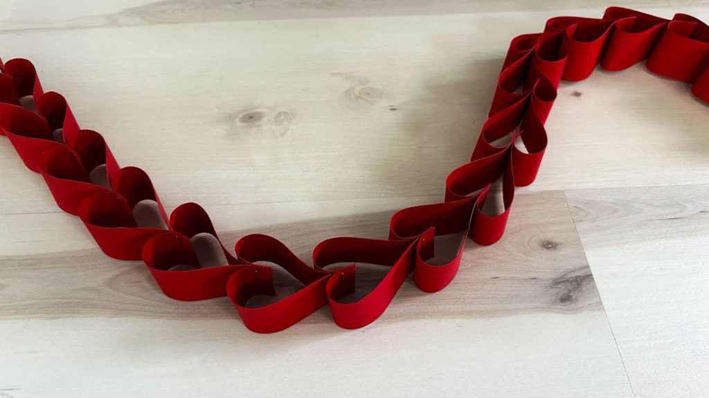 Long paper heart garland on wood floor