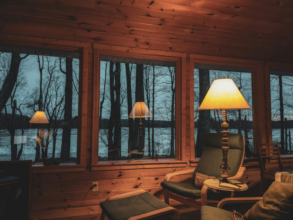 Interior cabin with blue chair and yellow light turned on