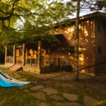 A cabin with a hammock hanging in front of it in Minnesota